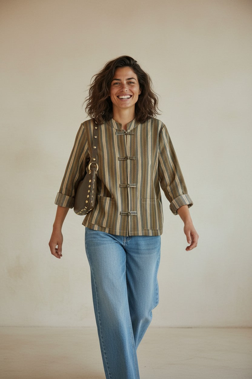 Calendula-shop Bombay shirt with fine stripes, mao collar, and fabric knot closures worn by a smiling woman