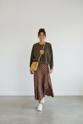 Calendula-shop chocolate brown cropped sweatshirt with exclusive sun graphic, worn with a striped midi skirt