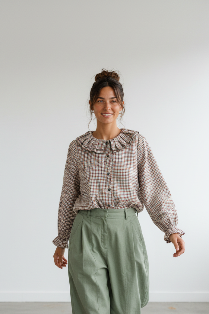 Calendula-shop Julieta long-sleeve blouse in brown gingham check with a ruffled round collar and button-down front.