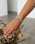 Pulsera Calendula-shop de plata 925 con piedras de aguamarina y detalle de estrella de mar, hecha a mano.