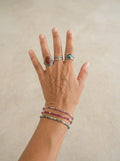 Pulseras Calendula-shop de bolitas de piedras naturales y plata de ley 925 con anillos a juego en mano femenina