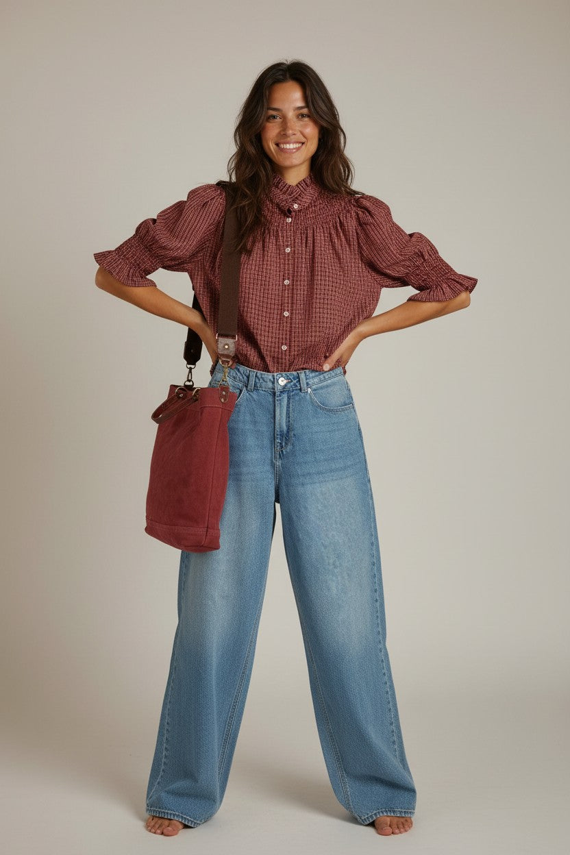 Calendula-shop Sicilia rose canvas tote bag with dual straps worn by a smiling woman in a red blouse and blue jeans